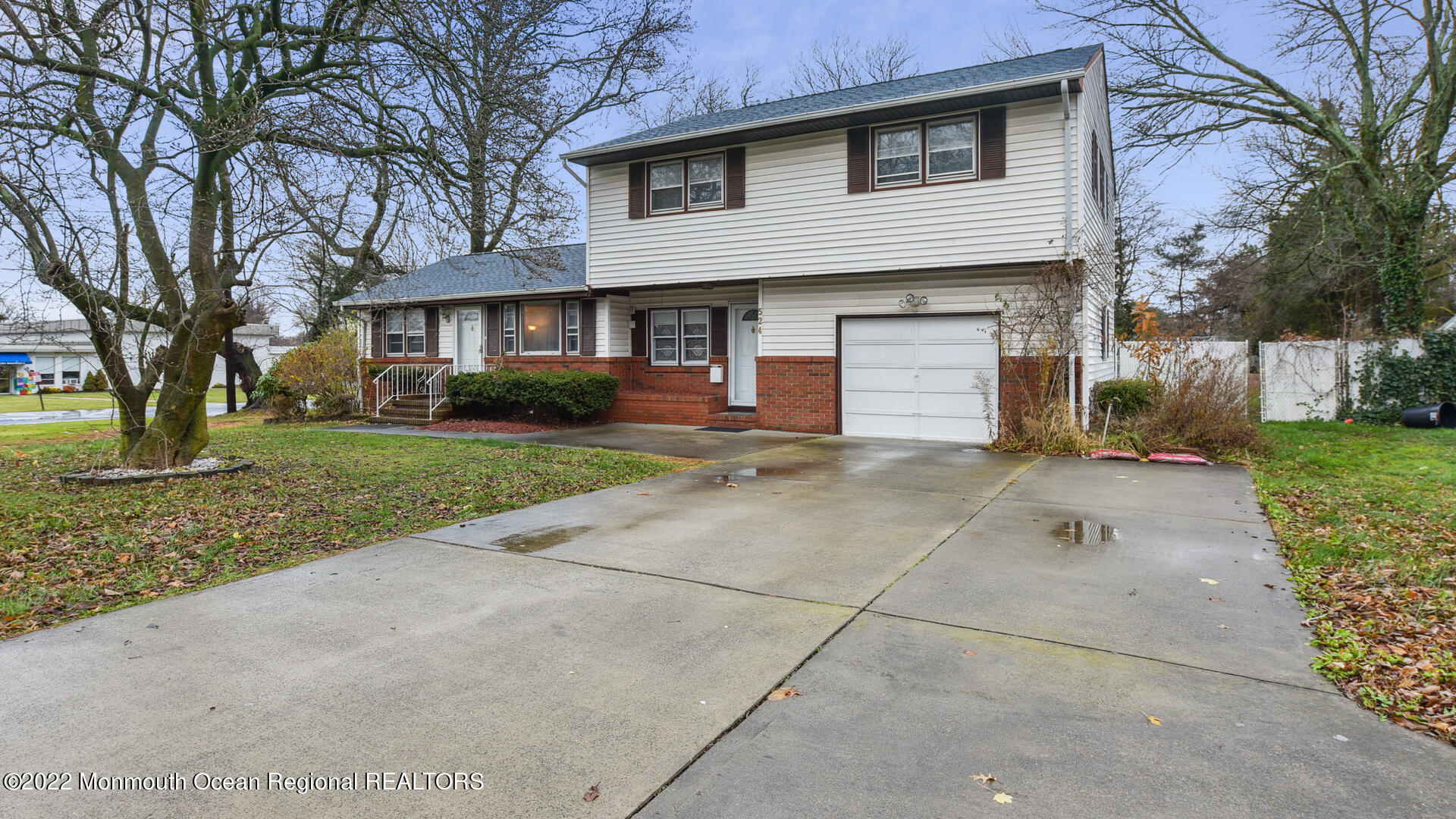 524 Lloyd Road Matawan, NJ 07747 - Photo 1 of 25 a front view of a house with a yard and garage