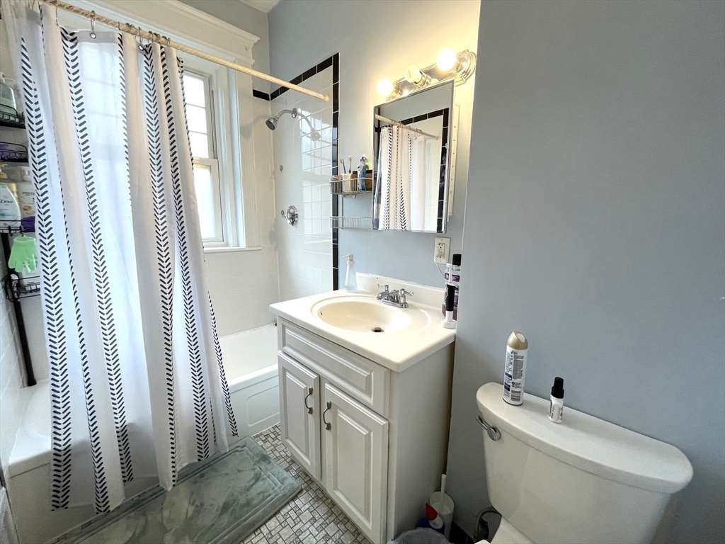 5 Spofford Road, Unit 11 Boston, MA 02134 - Photo 13 of 14 a bathroom with a sink toilet and shower