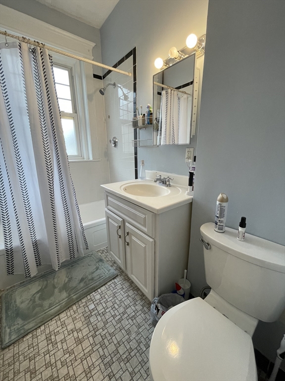 5 Spofford Road, Unit 11 Boston, MA 02134 - Photo 14 of 14 a white toilet sitting next to a bathroom sink