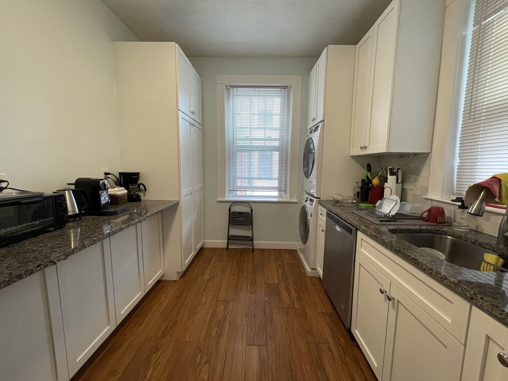 5 Spofford Road, Unit 11 Boston, MA 02134 - Photo 2 of 14 a kitchen with a sink wooden floor and a window