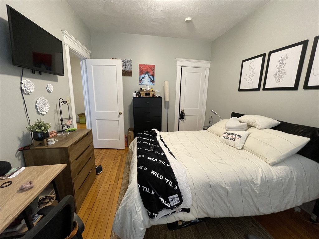 5 Spofford Road, Unit 11 Boston, MA 02134 - Photo 6 of 14 a bedroom with a bed and flat screen tv