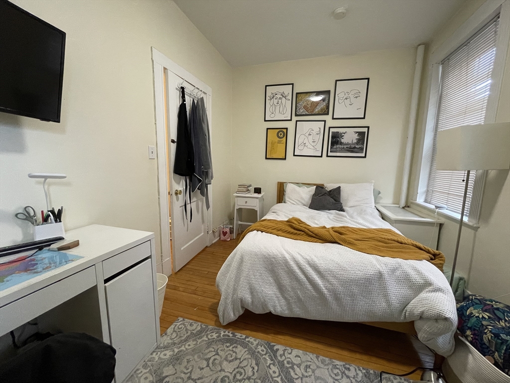 5 Spofford Road, Unit 11 Boston, MA 02134 - Photo 7 of 14 a bedroom with a bed and a flat screen tv