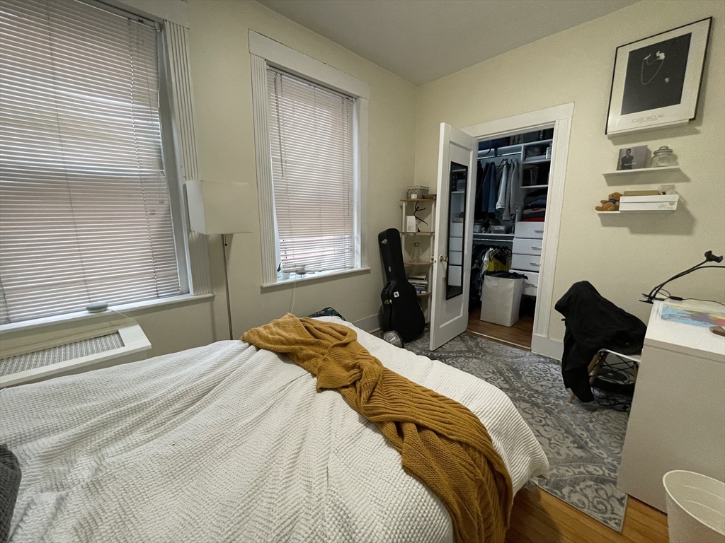 5 Spofford Road, Unit 11 Boston, MA 02134 - Photo 8 of 14 a bedroom with a bed and wooden floor