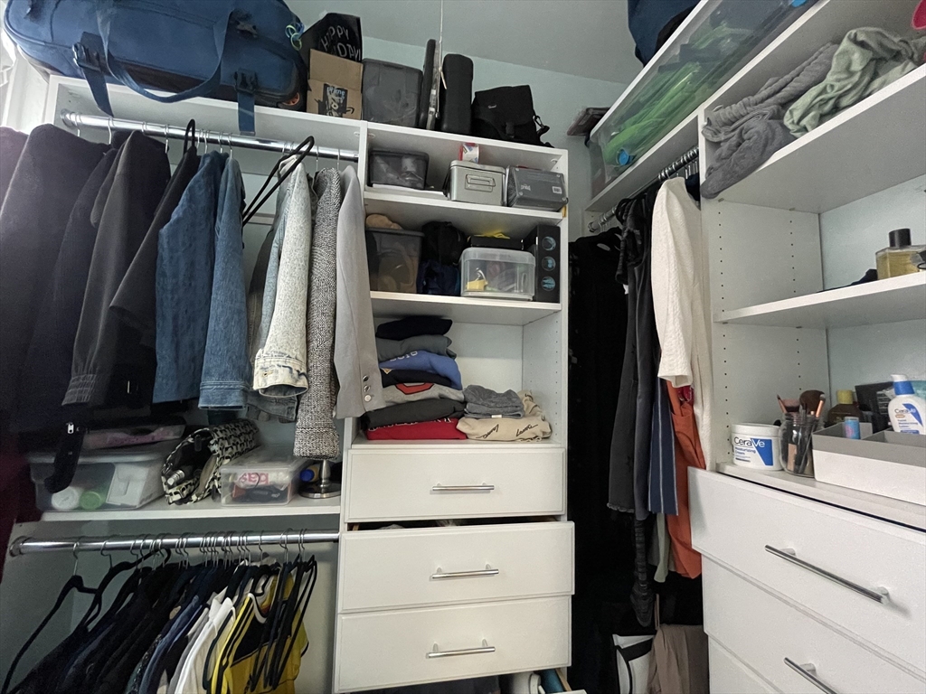 5 Spofford Road, Unit 11 Boston, MA 02134 - Photo 9 of 14 a view of walk in closet with clothes and shoes