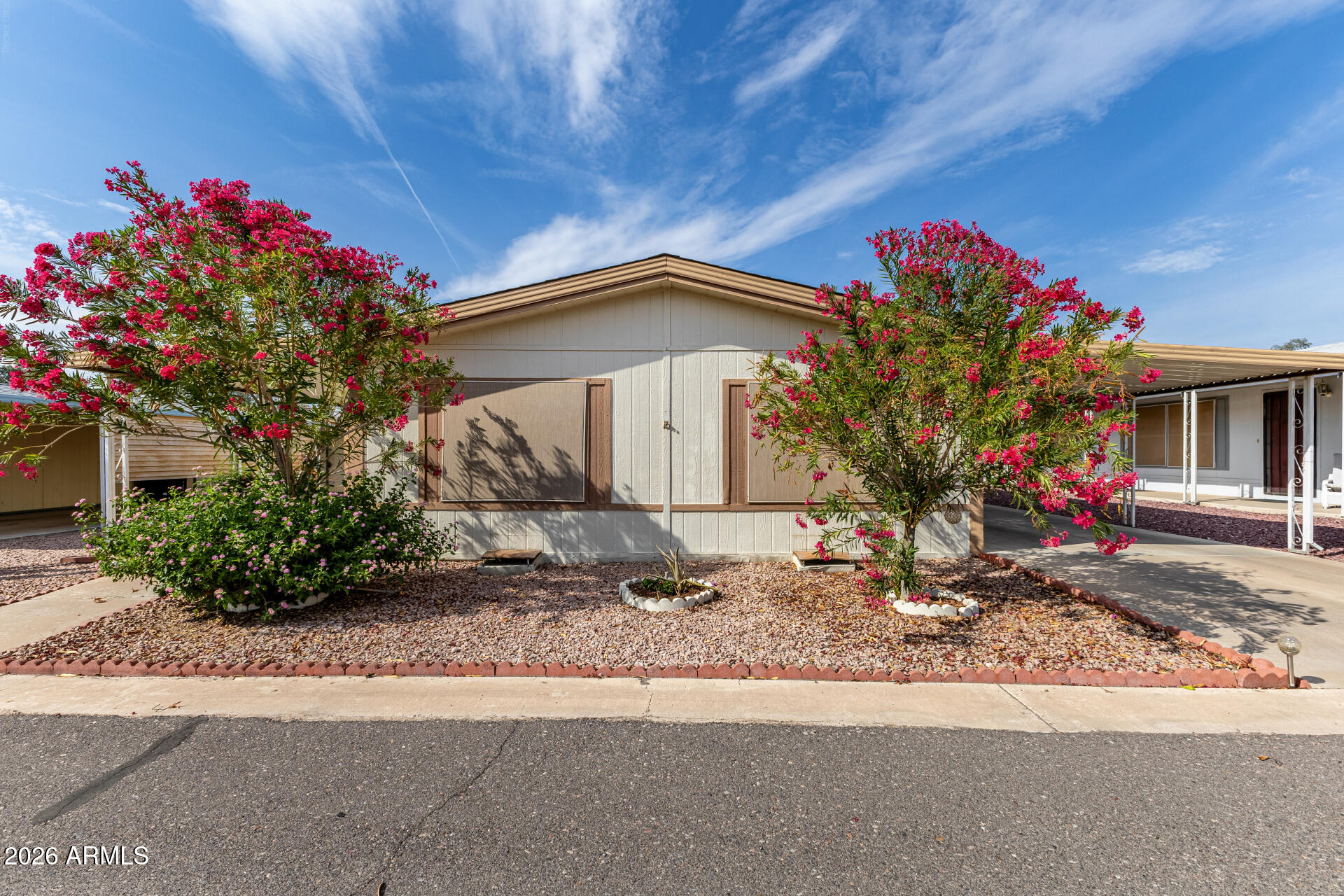 3330 East Main Street, Unit 448 Mesa, AZ 85213 - Photo 1 of 30 a front view of a house with a garage