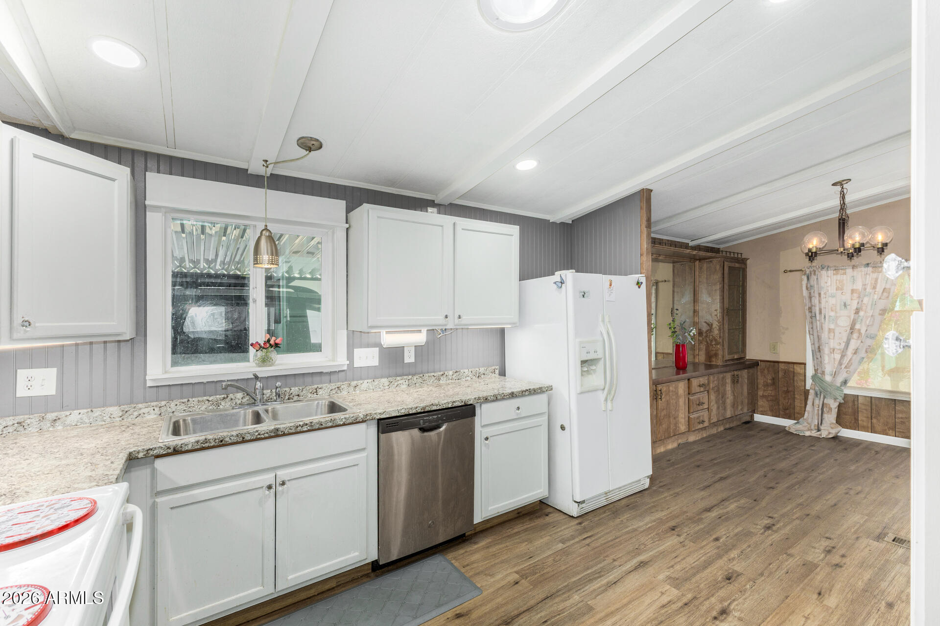 3330 East Main Street, Unit 448 Mesa, AZ 85213 - Photo 16 of 30 a kitchen with a sink stove and refrigerator