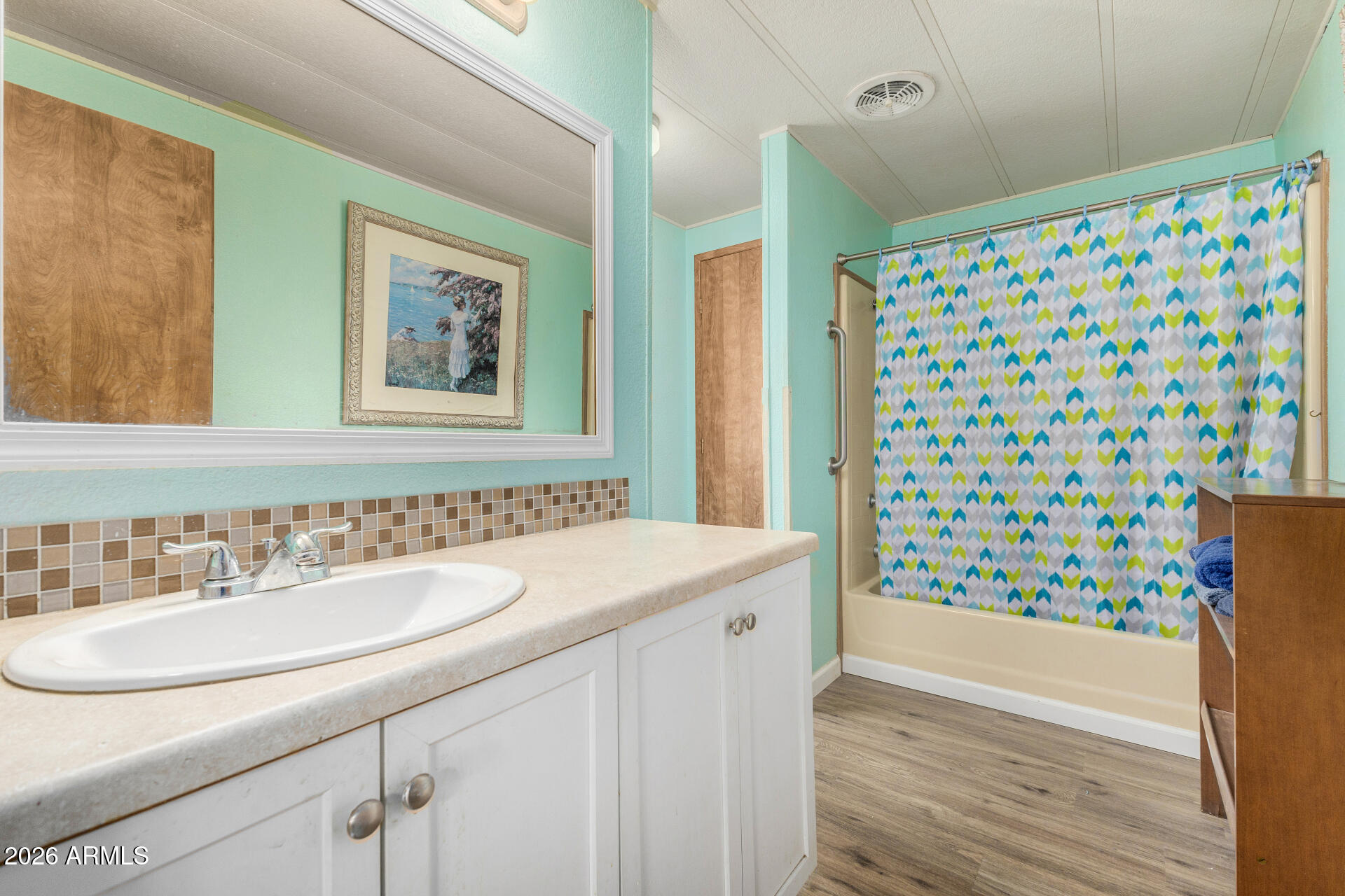 3330 East Main Street, Unit 448 Mesa, AZ 85213 - Photo 24 of 30 a bathroom with a sink and a mirror