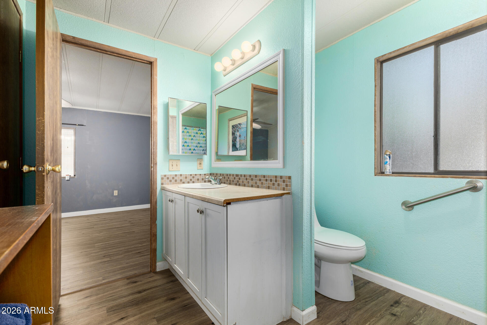 3330 East Main Street, Unit 448 Mesa, AZ 85213 - Photo 26 of 30 a bathroom with a granite countertop sink toilet and shower