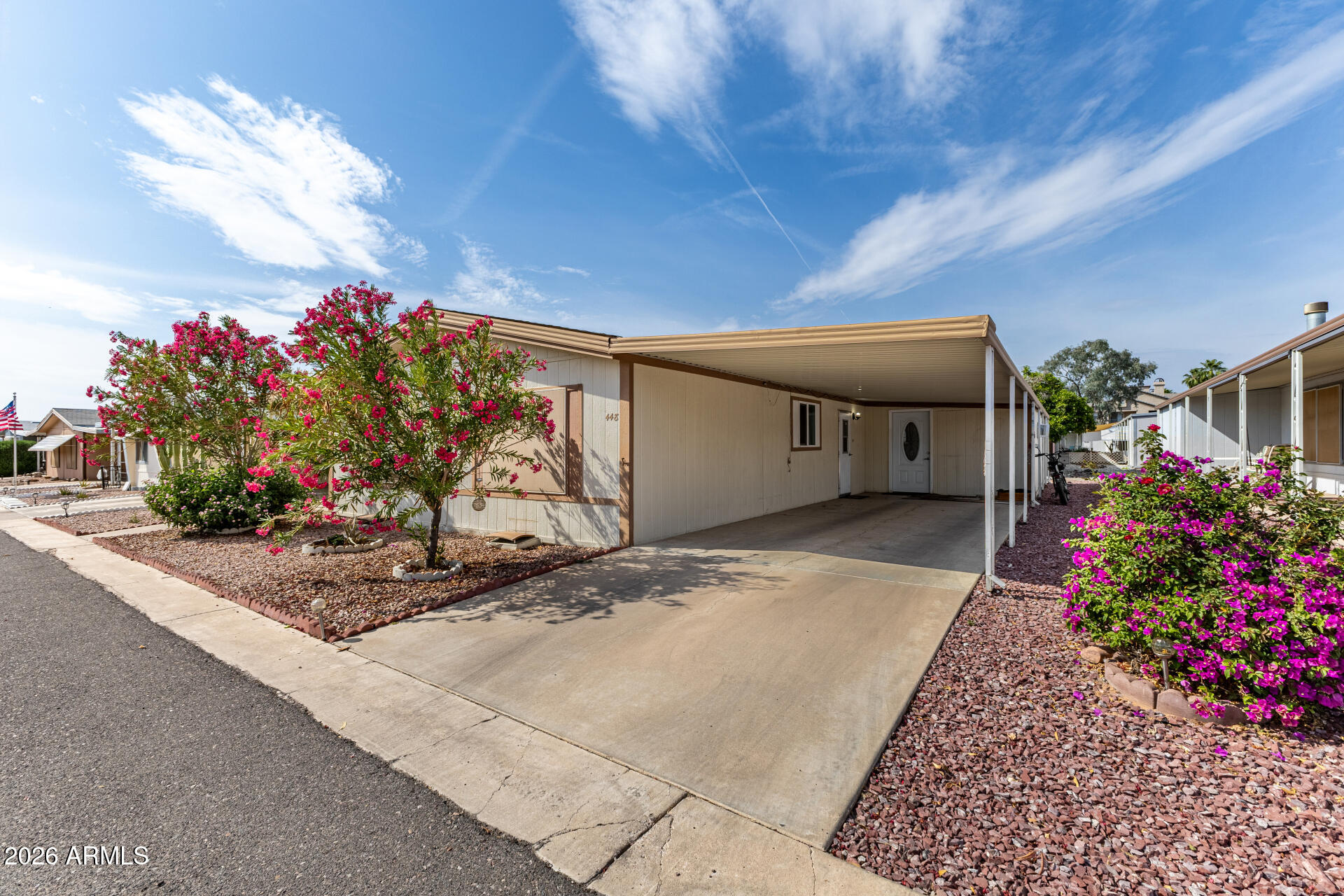 3330 East Main Street, Unit 448 Mesa, AZ 85213 - Photo 3 of 30 a front view of a house with a garage