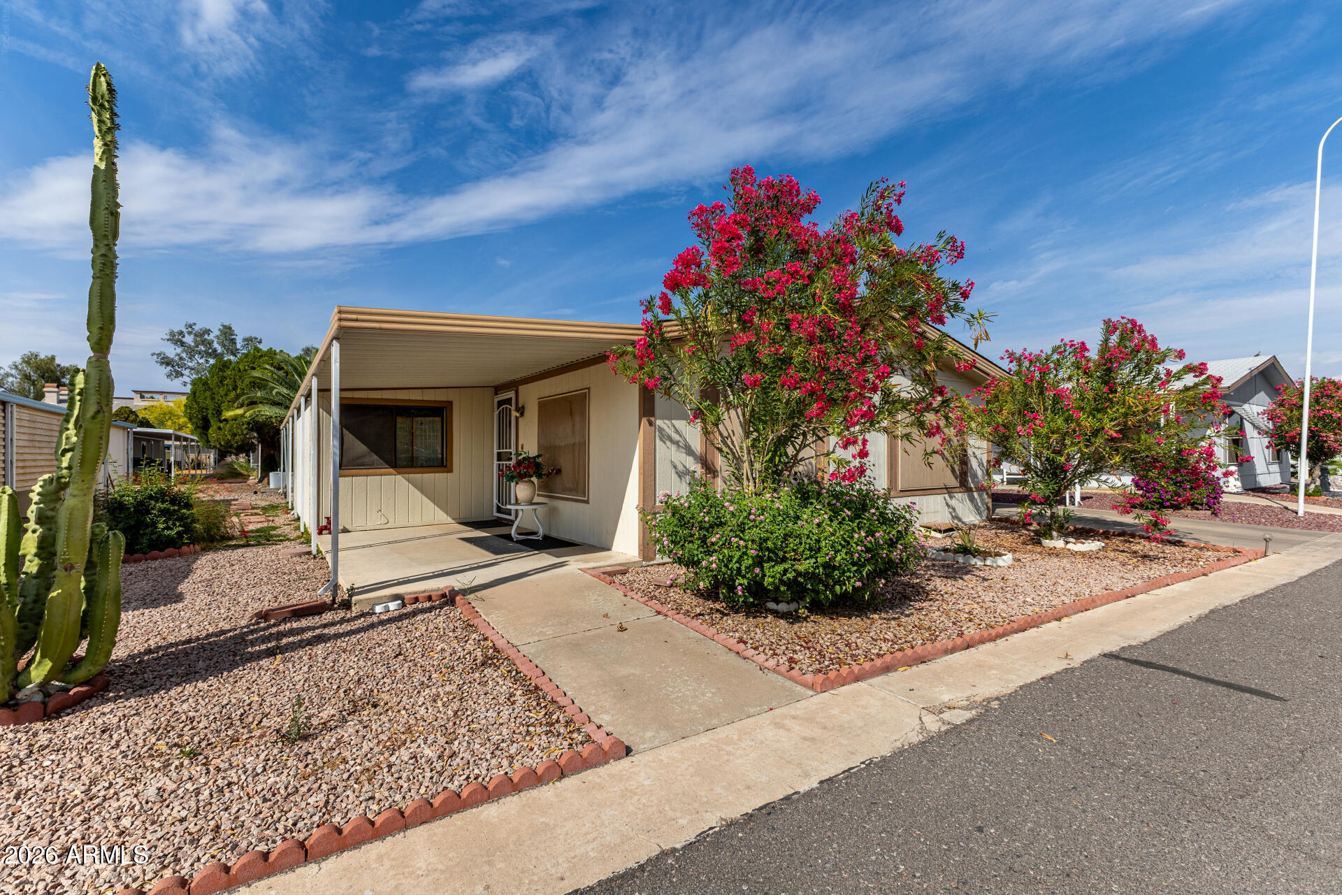 3330 East Main Street, Unit 448 Mesa, AZ 85213 - Photo 5 of 30 a front view of a house with a porch
