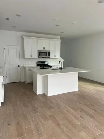 a view of a kitchen with a sink