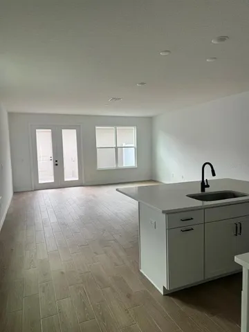 a view of a kitchen with a sink and a window