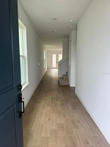 a view of a hallway with a livingroom