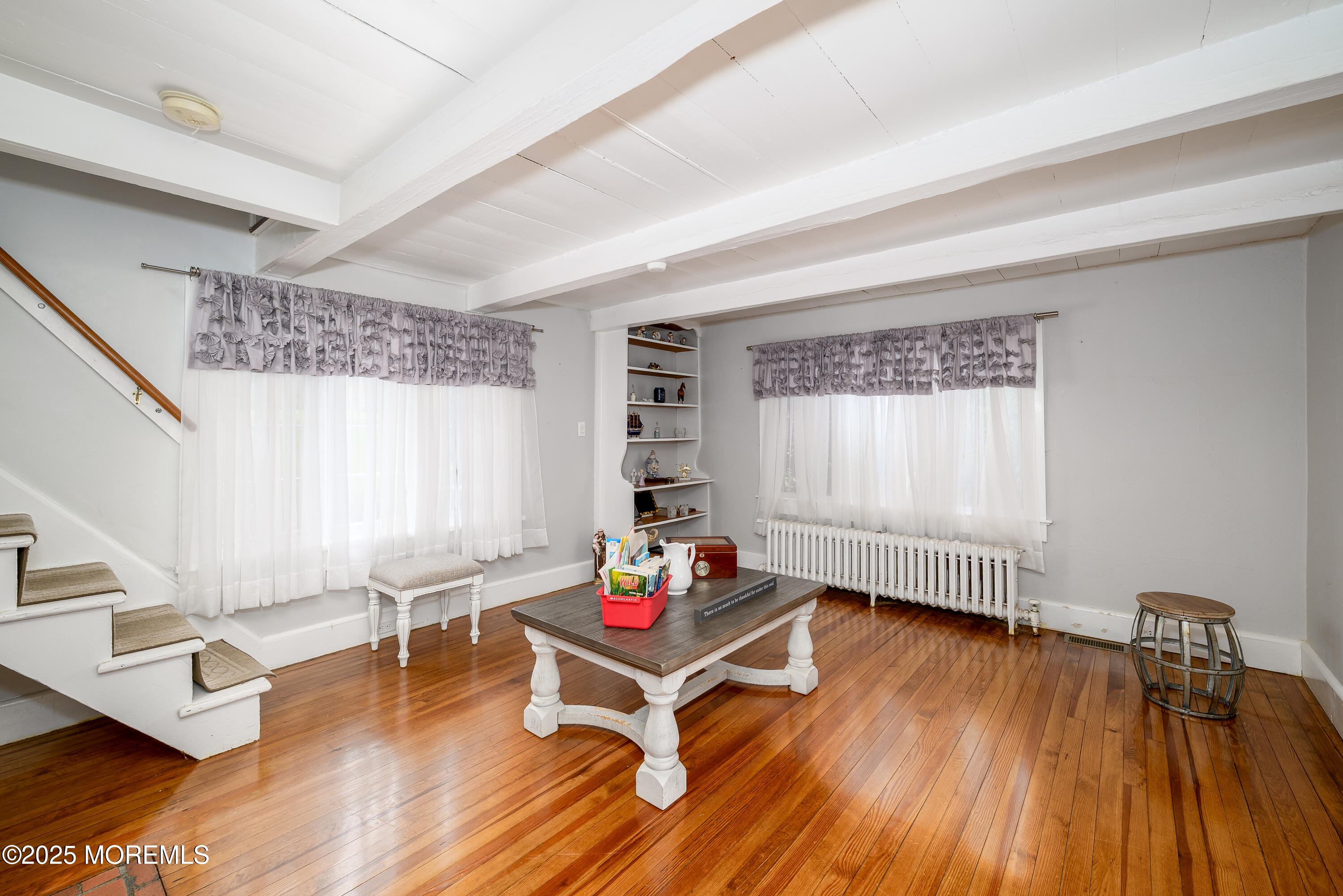 19 Reids Hill Road Morganville, NJ 07751 - Photo 14 of 33 a living room with furniture and a wooden floor