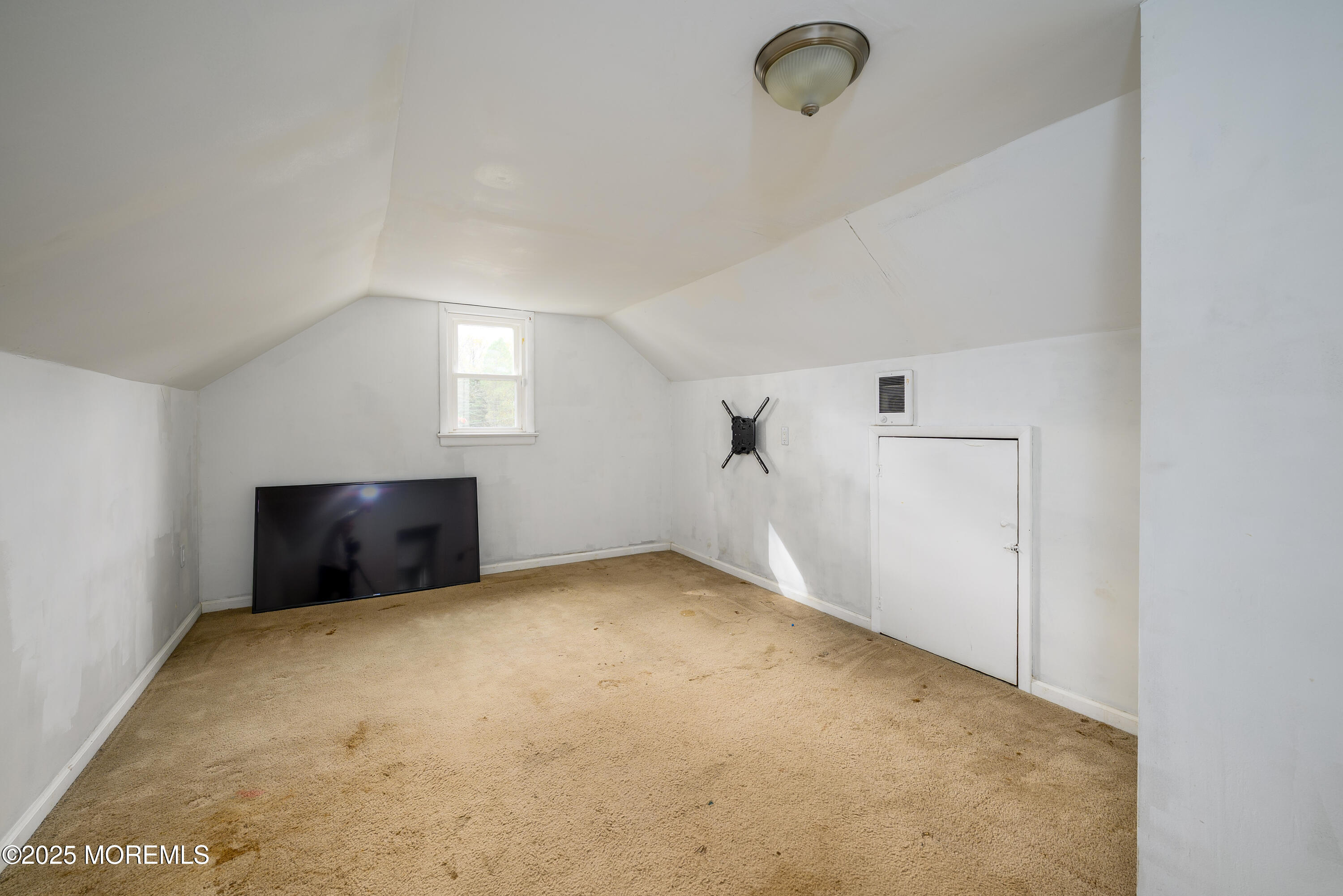19 Reids Hill Road Morganville, NJ 07751 - Photo 21 of 33 an empty room with windows and fireplace