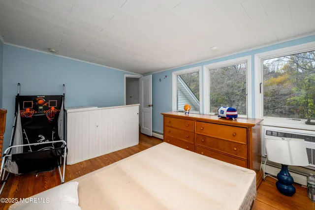 a bed room with a bed and a large window