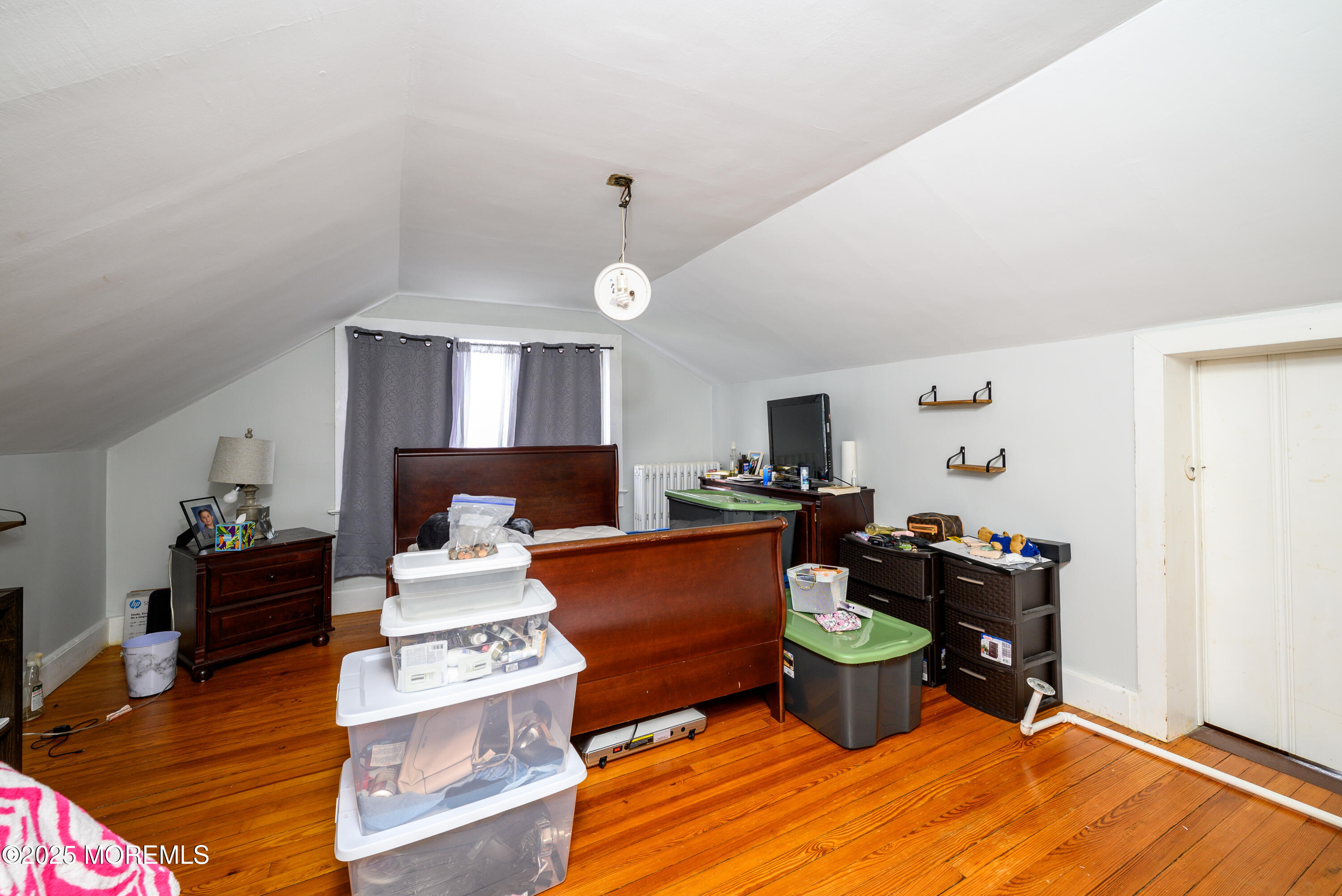 19 Reids Hill Road Morganville, NJ 07751 - Photo 25 of 33 a living room with furniture and a wooden floor