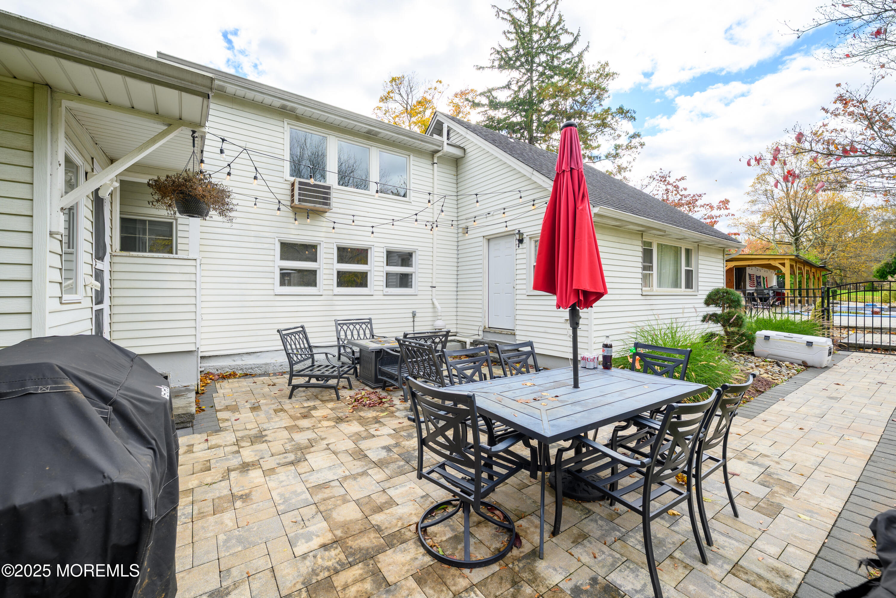 19 Reids Hill Road Morganville, NJ 07751 - Photo 26 of 33 a view of a house with backyard and sitting area
