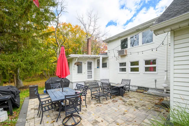 a view of a dinning table and chairs in the patio