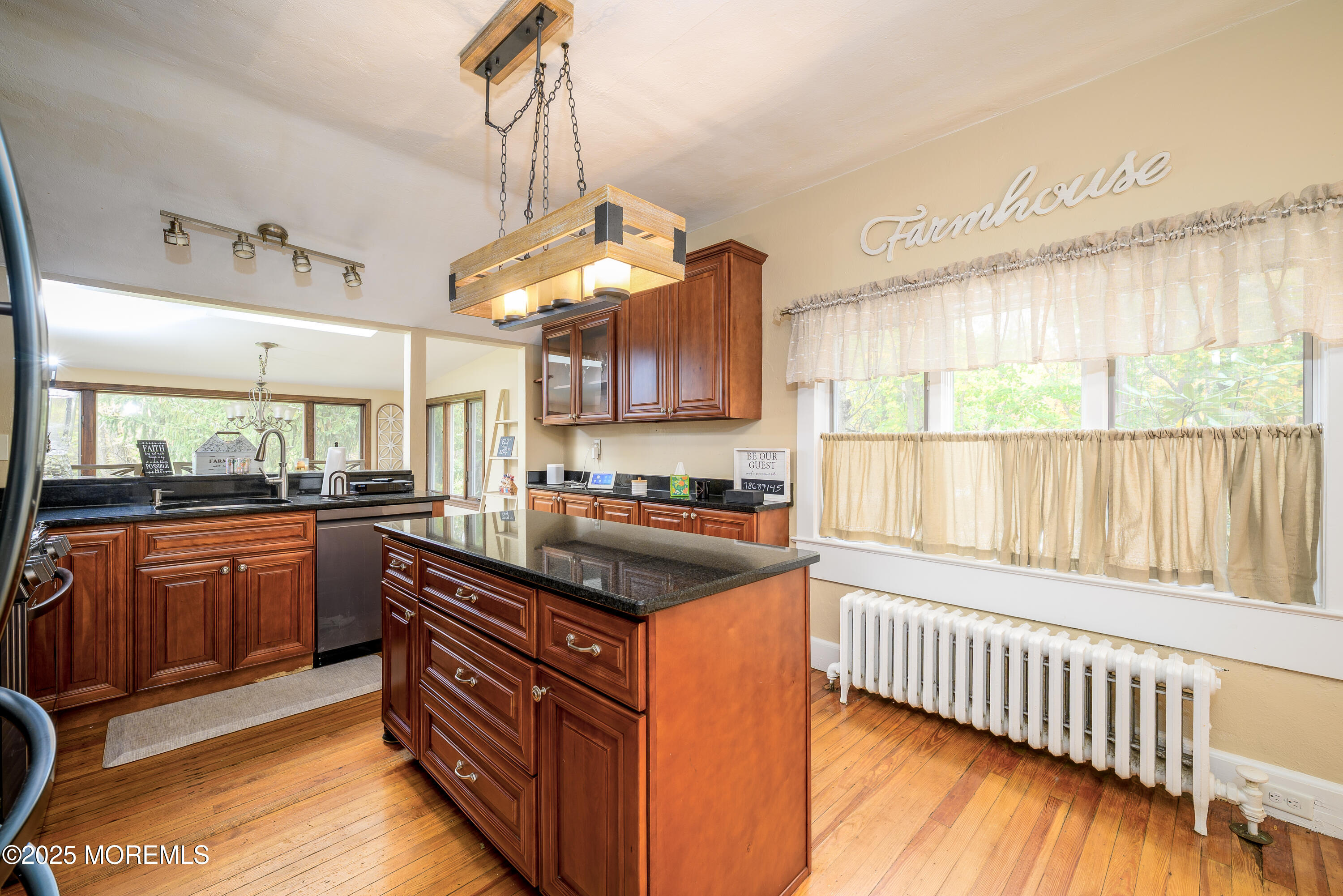 19 Reids Hill Road Morganville, NJ 07751 - Photo 6 of 33 a kitchen with stainless steel appliances granite countertop a stove and a sink
