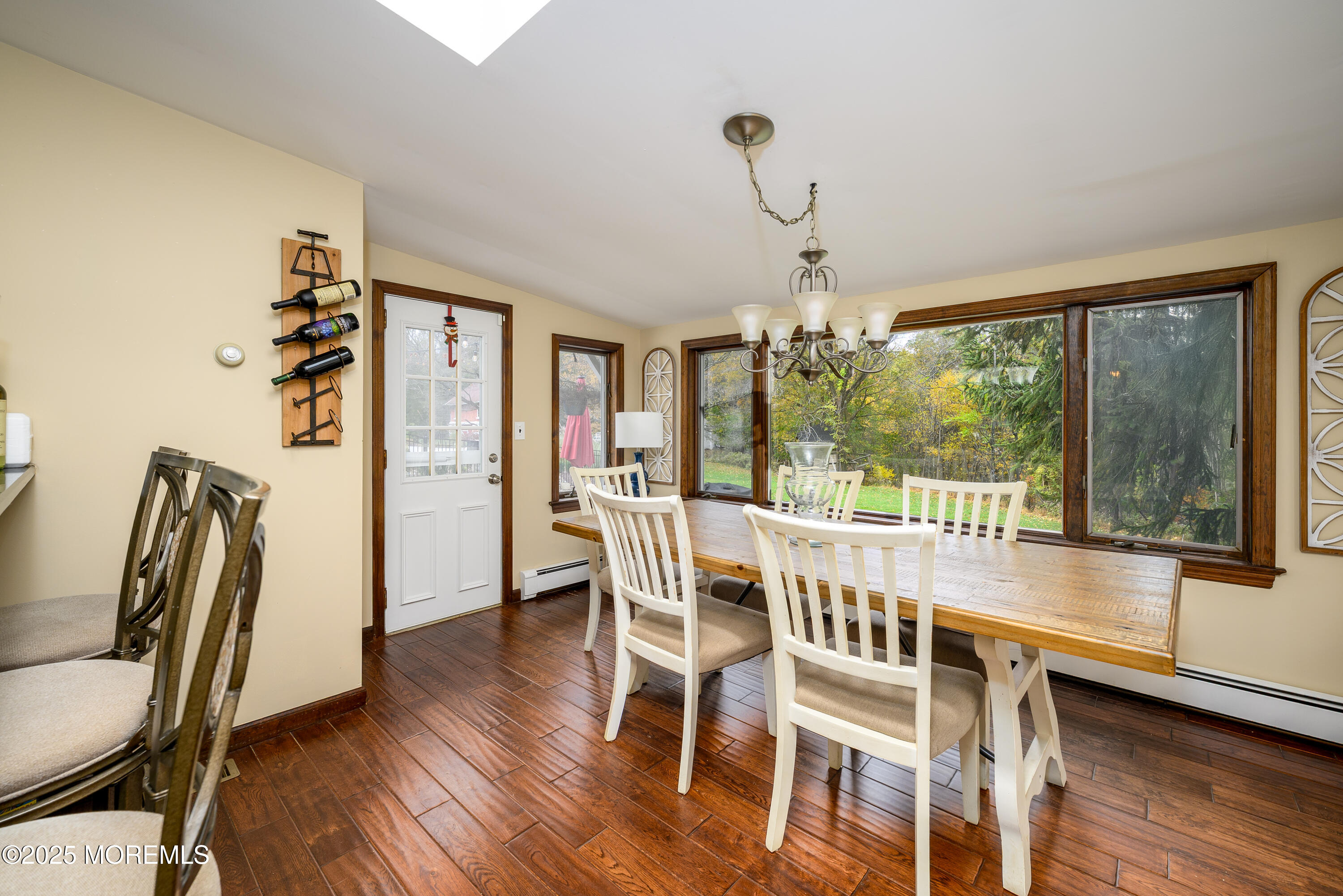 19 Reids Hill Road Morganville, NJ 07751 - Photo 10 of 33 a view of a dining room with furniture window and wooden floor