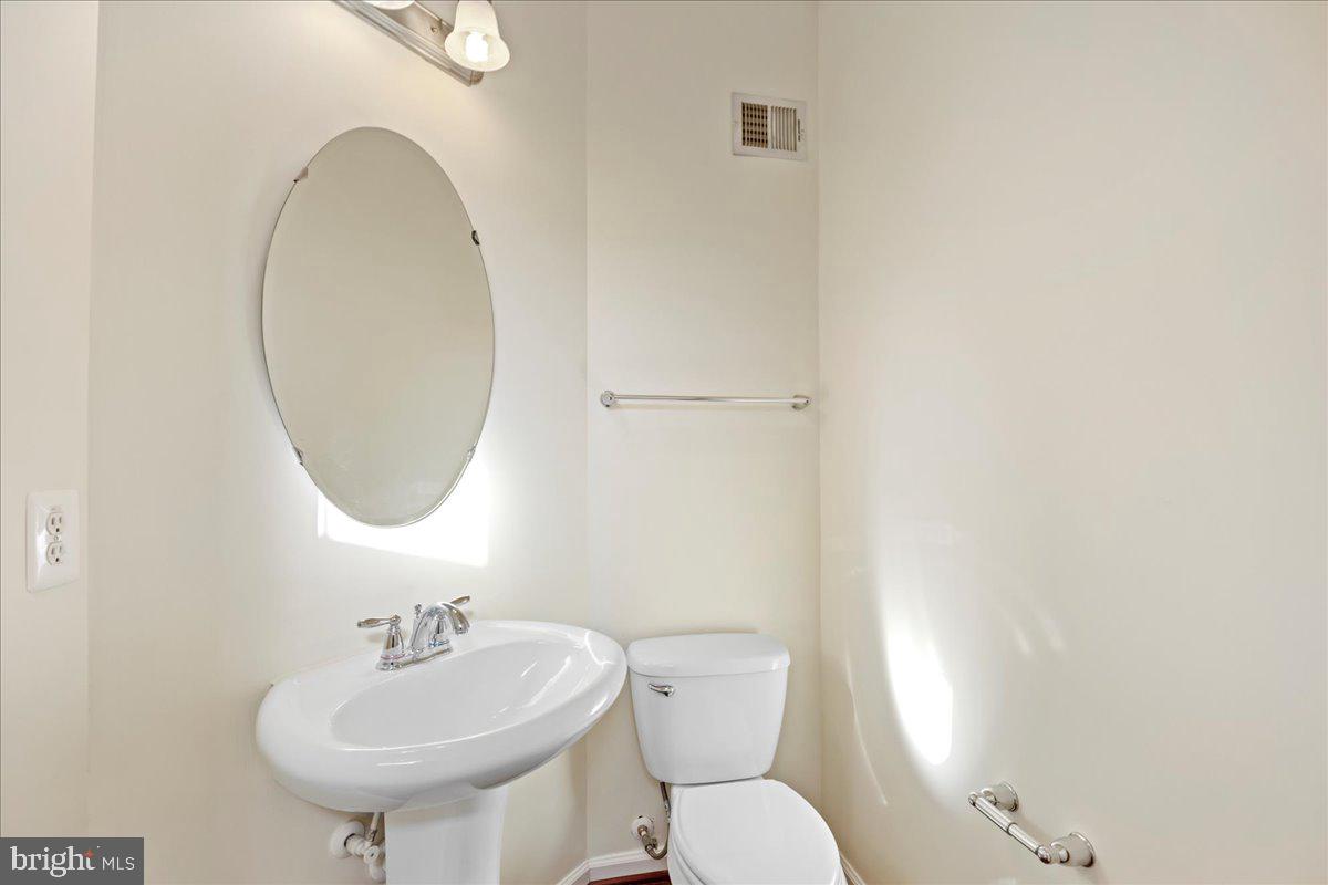 2602 St Marys View Road Accokeek, MD 20607 - Photo 8 of 47 a bathroom with a toilet sink and mirror