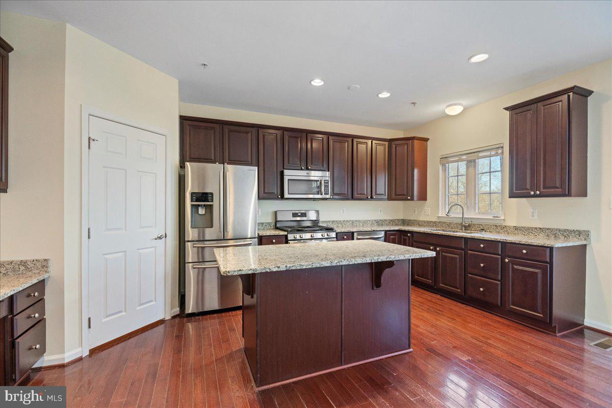 2602 St Marys View Road Accokeek, MD 20607 - Photo 10 of 47 a kitchen with wooden cabinets and stainless steel appliances
