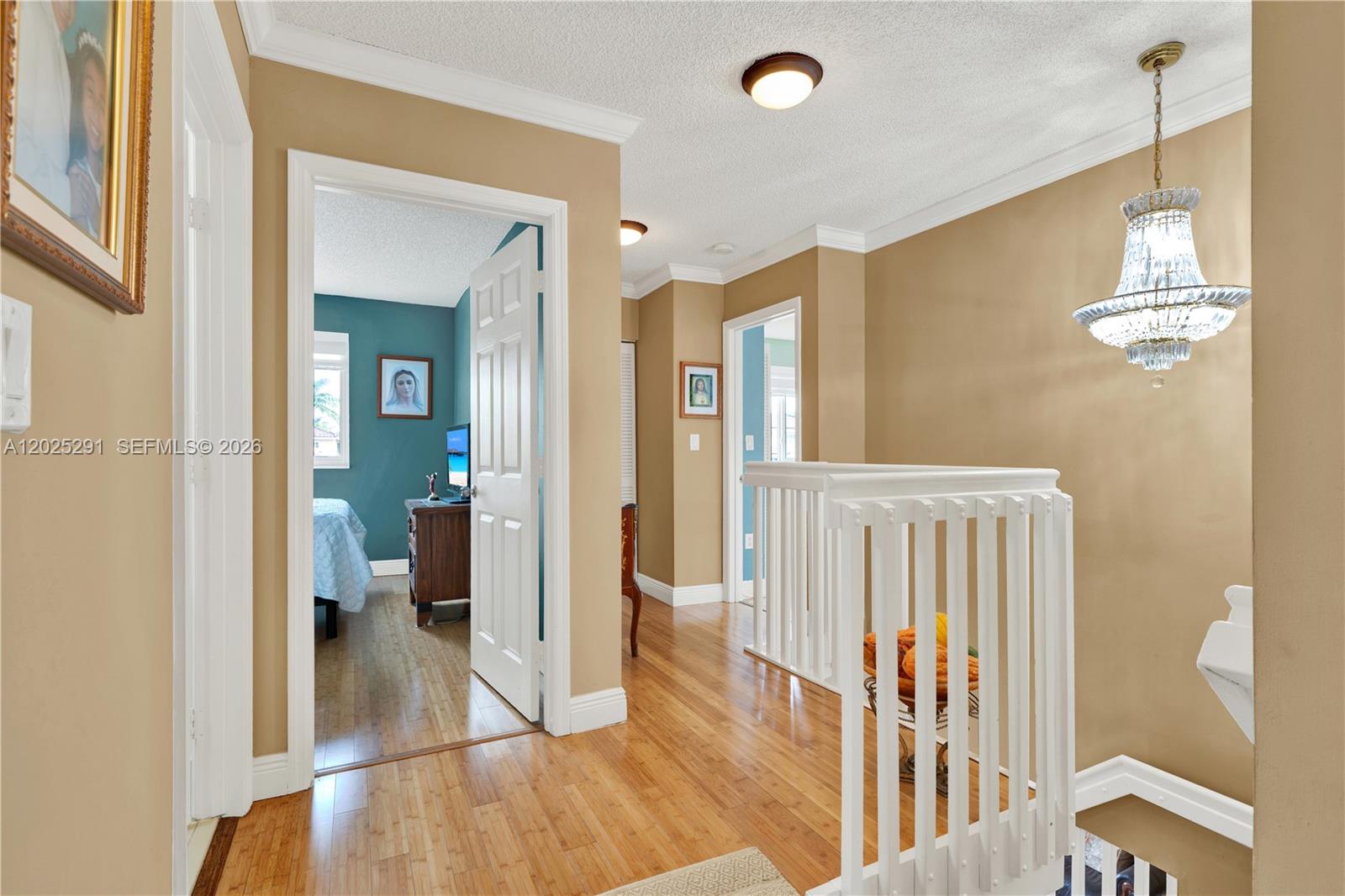 10006 Southwest 162nd Path Miami, FL 33196 - Photo 17 of 40 a view of a hallway view with wooden floor and staircase