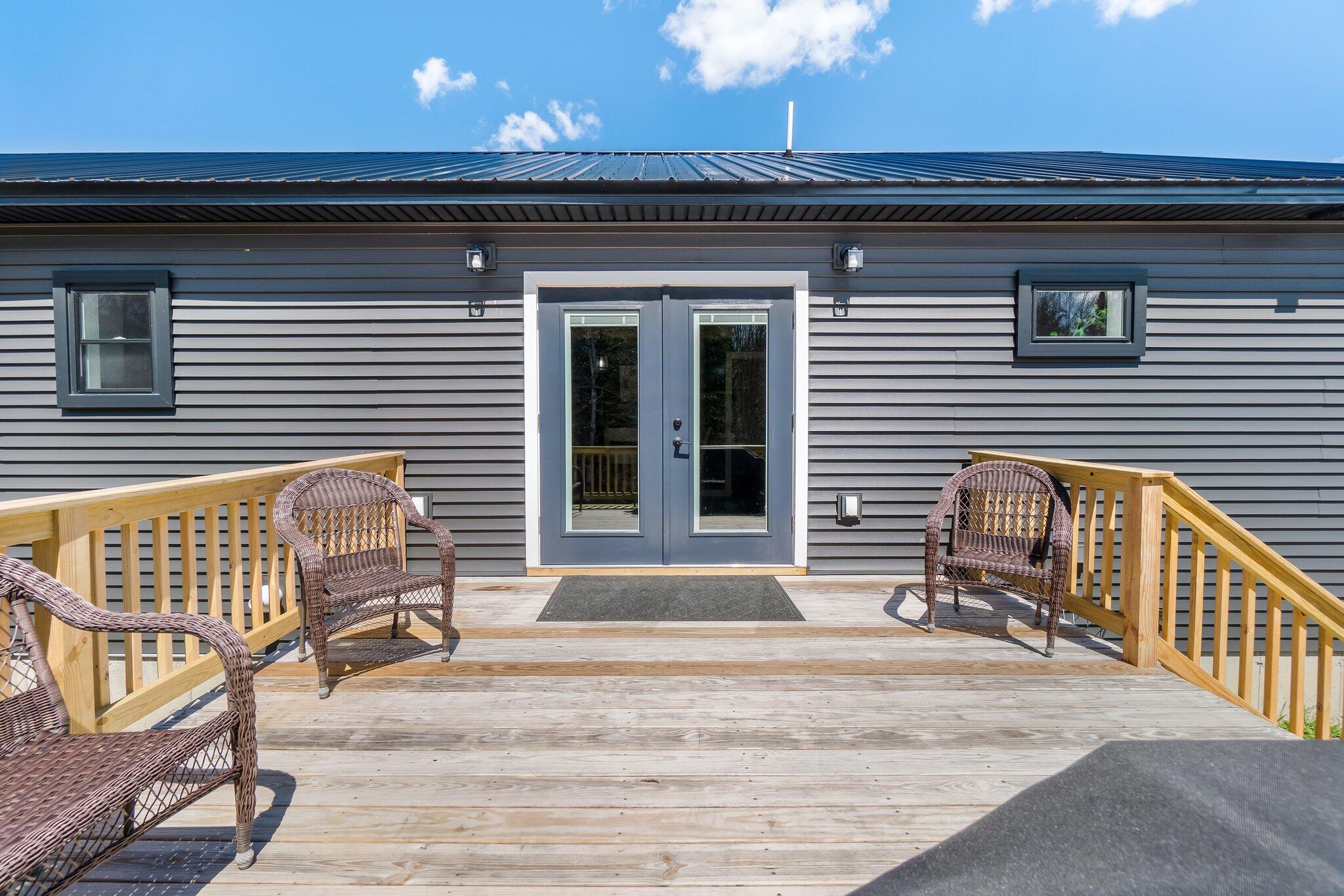 842 Maxfield Road Lagrange, ME 04453 - Photo 54 of 59 Backdeck to Door