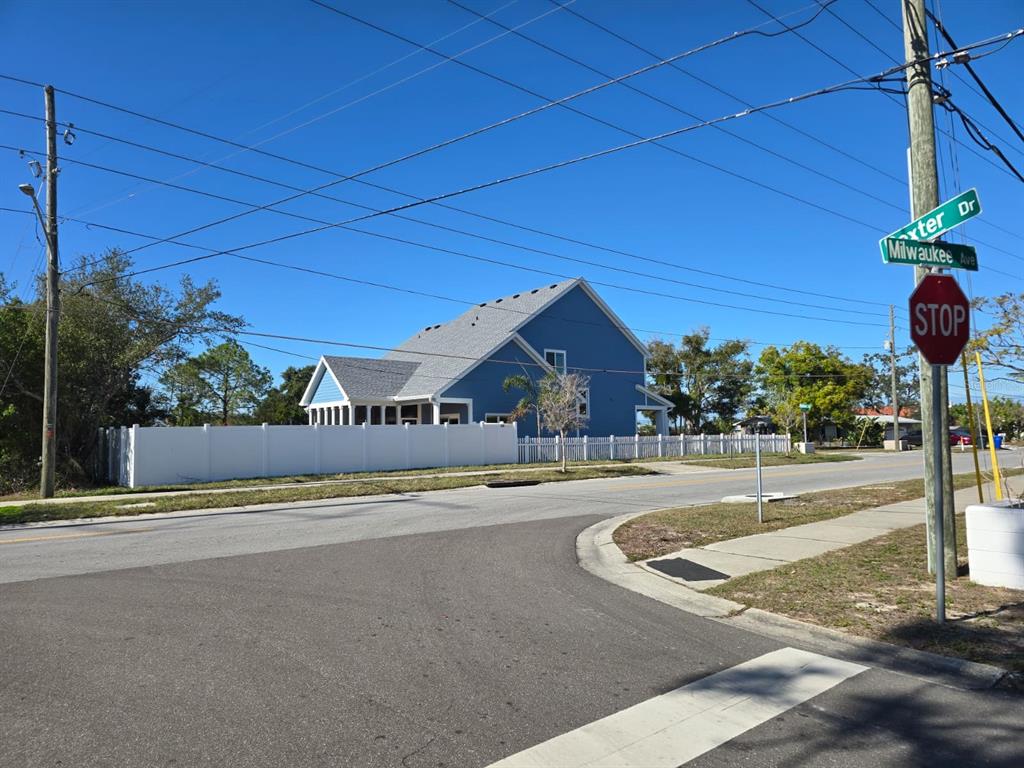 Milwaukee Avenue Dunedin, FL 34698 - Photo 5 of 7 a view of a house with a yard and potted plants
