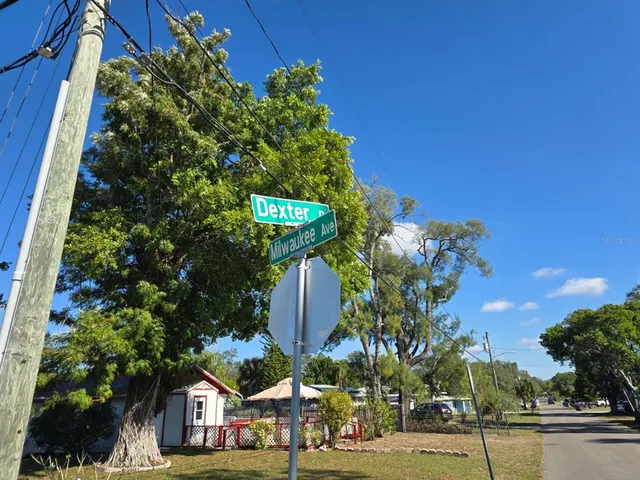 a view of multiple house with a yard and garden