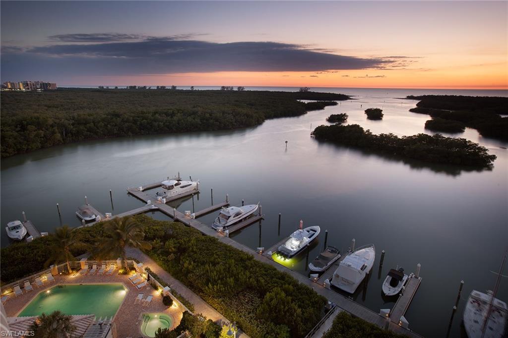 435 Dockside Drive, Unit B703 Naples, FL 34110 - Photo 36 of 38 a view of a lake from a balcony
