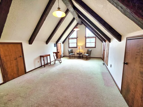 a view of an empty room and a window
