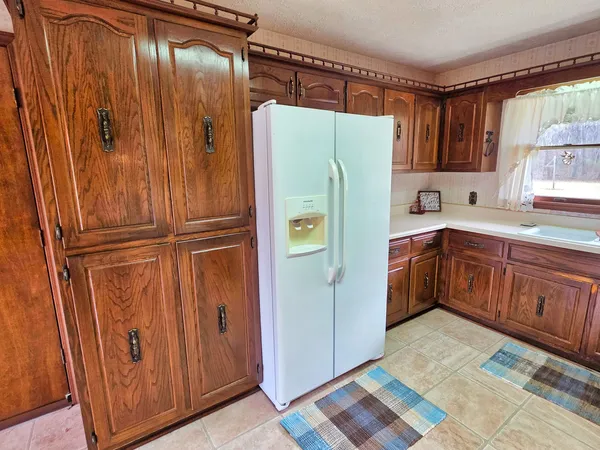 a view of empty room with stairs