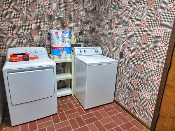 a view of a room with rack and a window
