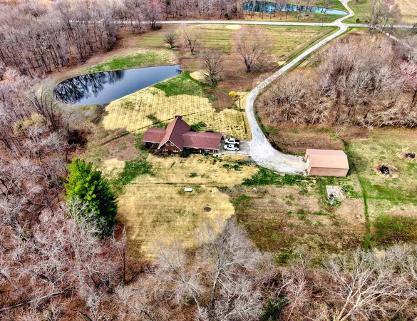 a view of a hallway with wooden floor and closet
