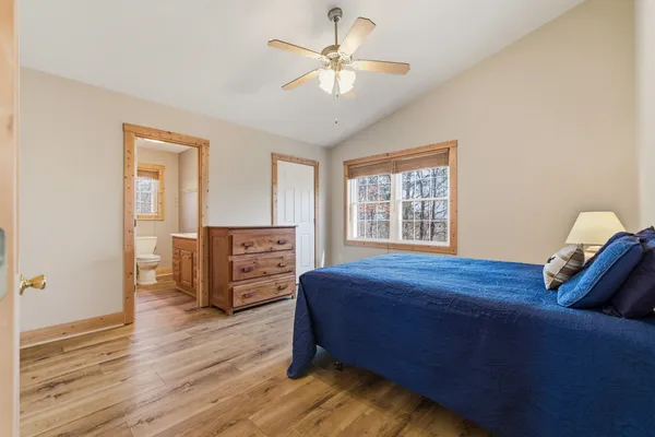 a bedroom with furniture and a window