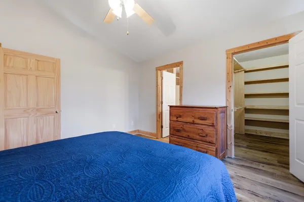 an empty room with closet and cabinet
