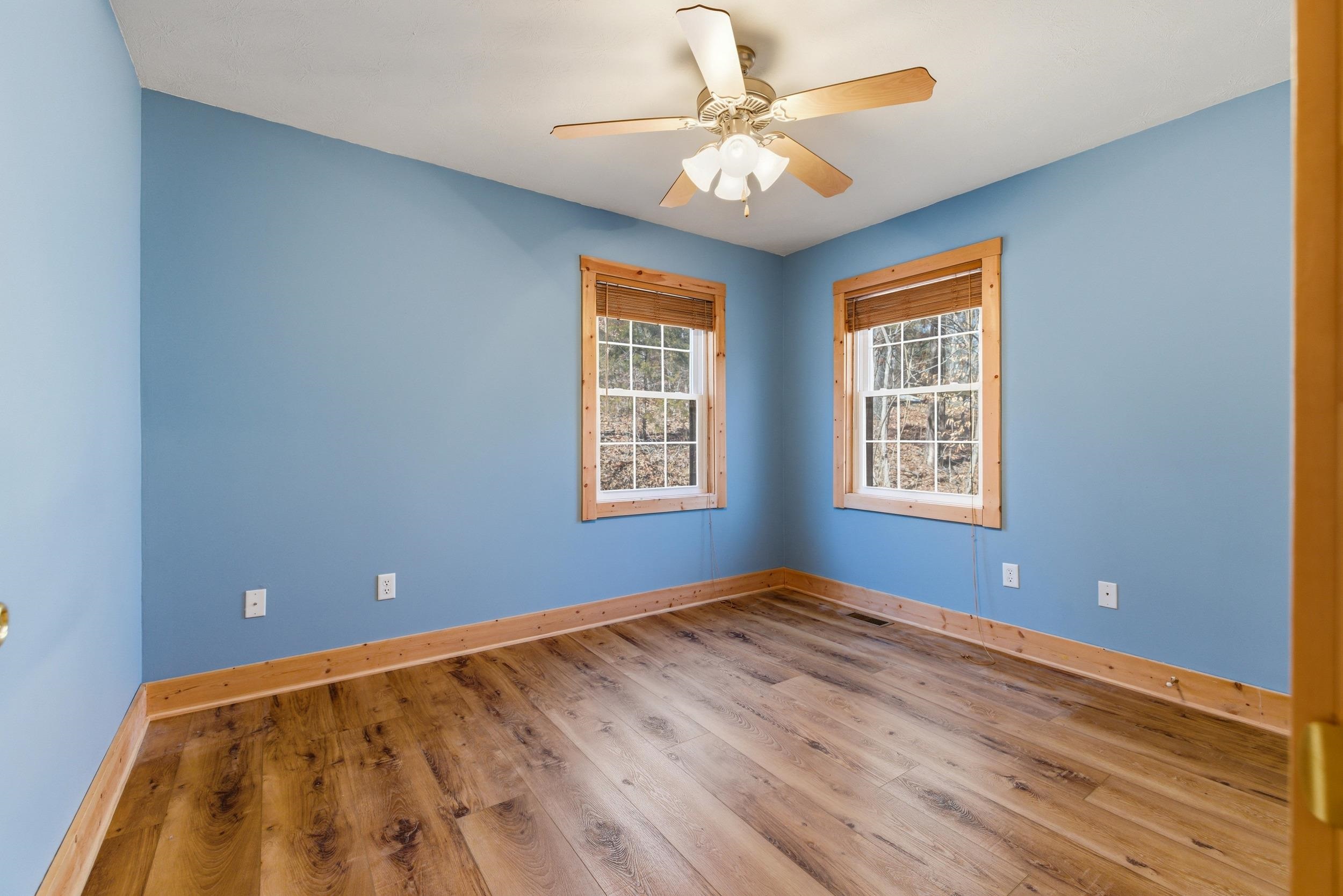 86 Maple Avenue Mount Jackson, VA 22842 - Photo 17 of 49 a view of an empty room with window and chandelier fan