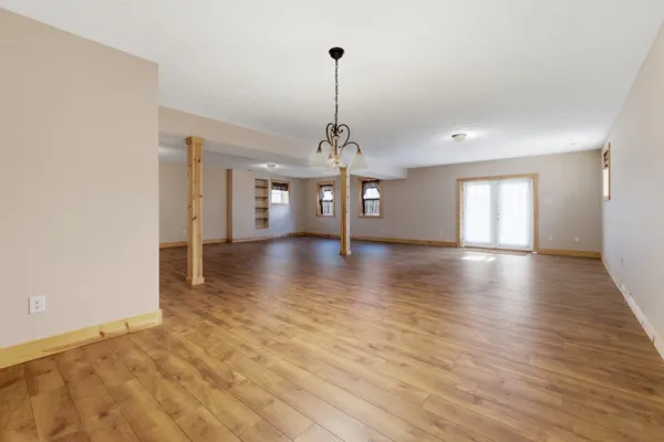 a view of a room with window wooden floor and windows