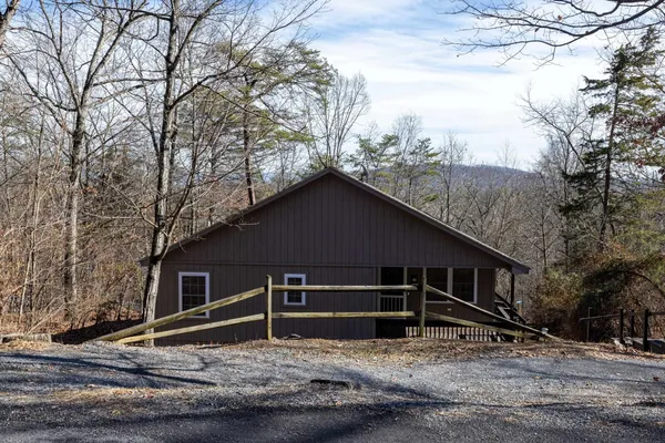 a house with trees in the background