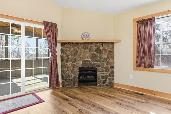 a view of a livingroom with furniture and a fireplace