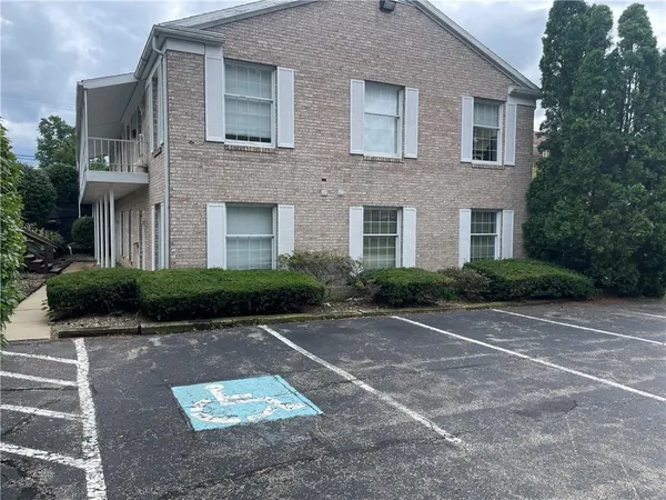 a front view of a house with yard