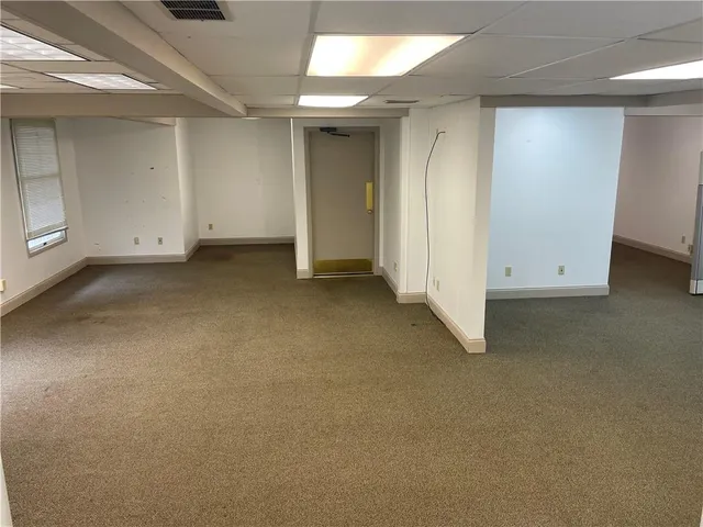a kitchen with white cabinets and a sink