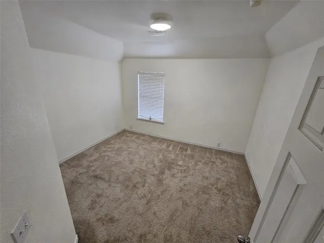 an empty room with a hardwood