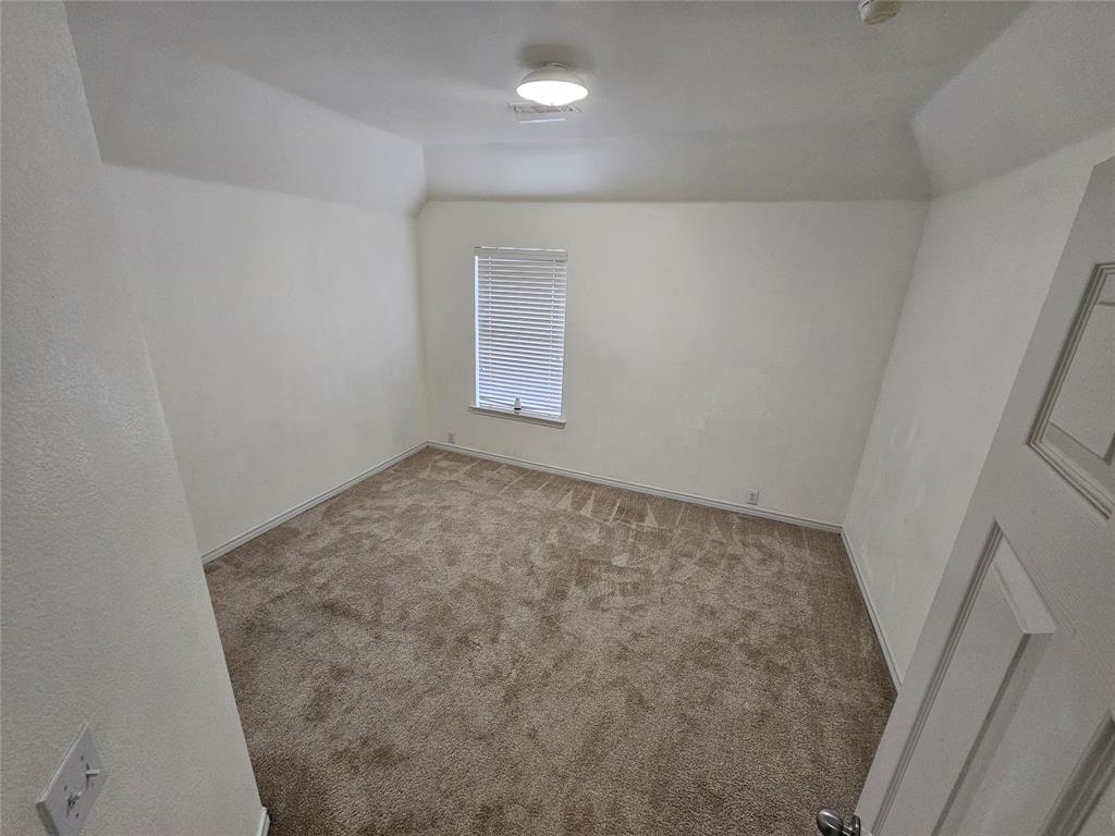 7341 Danbridge Lane Frisco, TX 75035 - Photo 12 of 14 an empty room with a hardwood