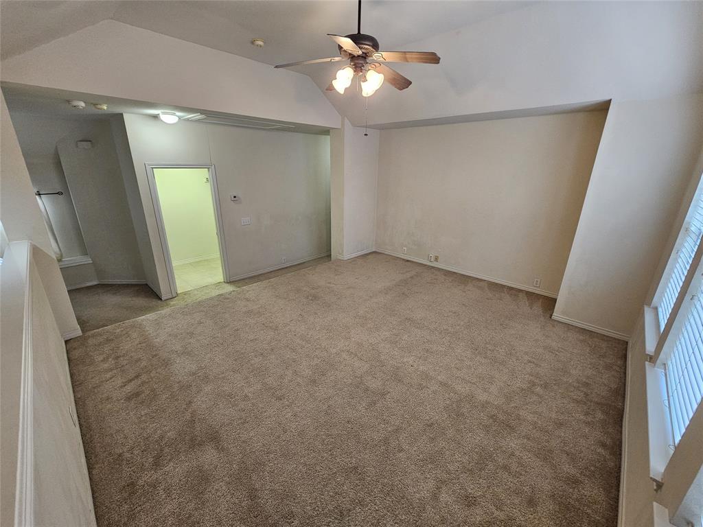 7341 Danbridge Lane Frisco, TX 75035 - Photo 10 of 14 en empty room with windows and entrance