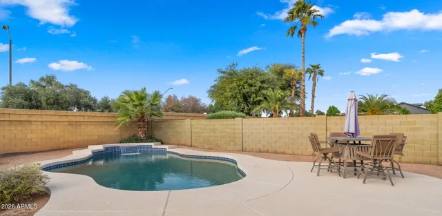 a view of a swimming pool with a plants