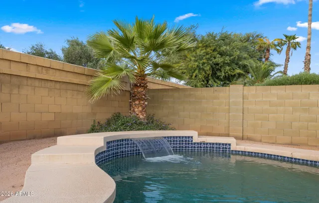 a view of a golf course with a house