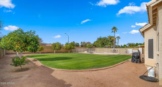 a view of a backyard with sitting area